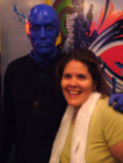 A blurry picture of me with a Blue Man.