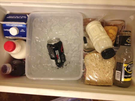 Snapware with ice and water and soda in cooler