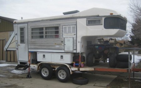 Truck Camper on a Flatbed Trailer